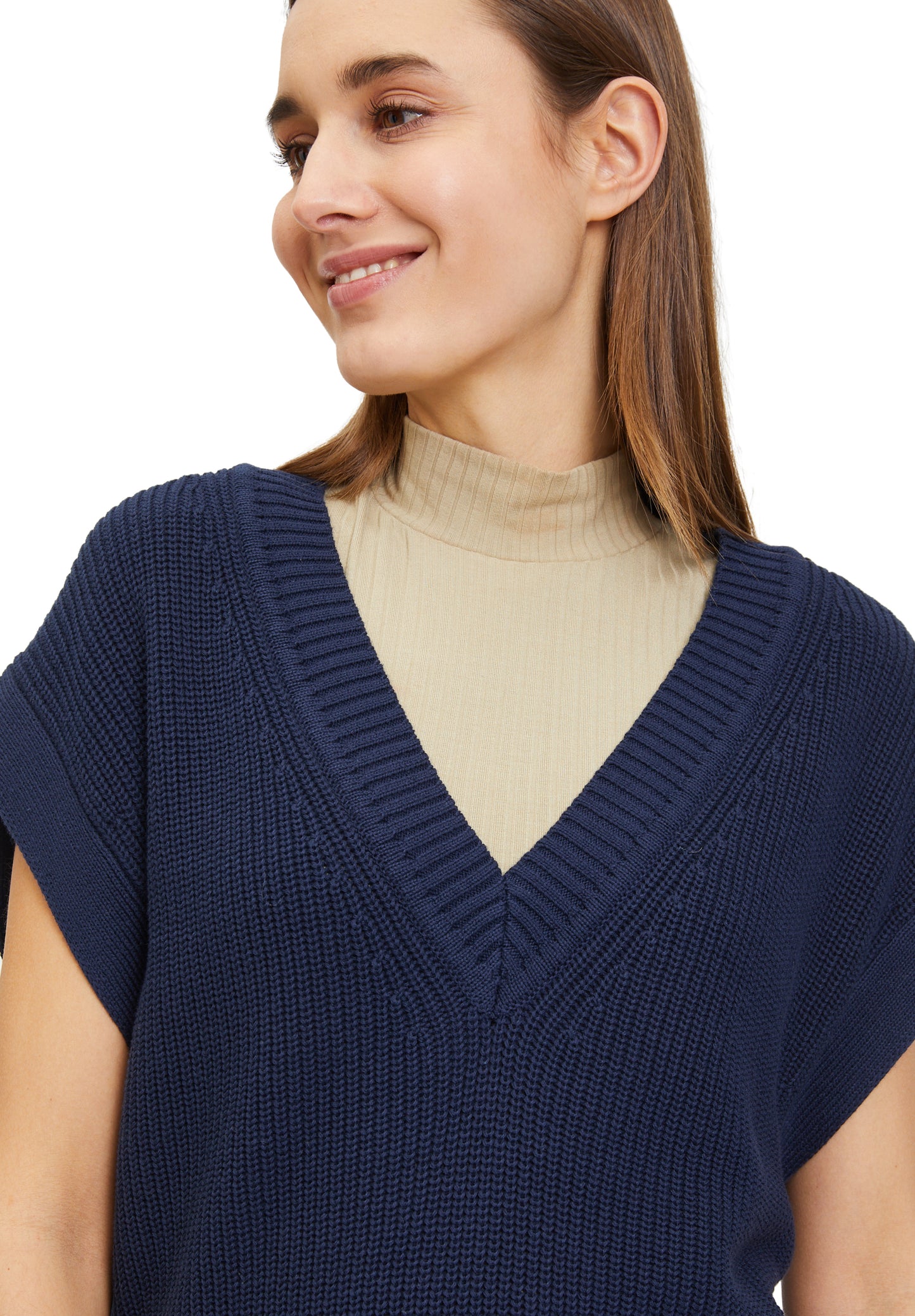 Short knitted sweater without sleeves