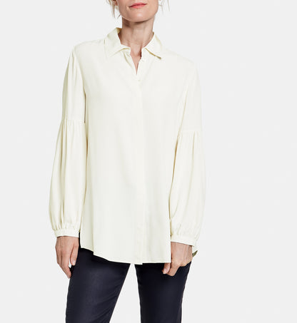 Blouse with flounced sleeves