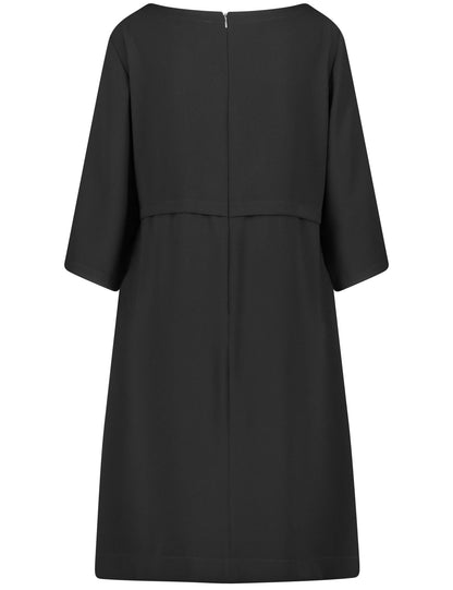 Short dress with dividing seam