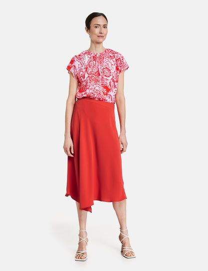 Midi skirt with asymmetrical hem